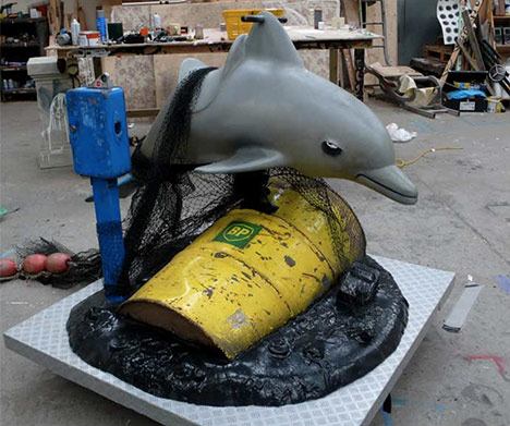 Banksy-kiddie-ride-dolphin-bp-oil-photo Banksy-kiddie-ride-dolphin-bp-oil-photo